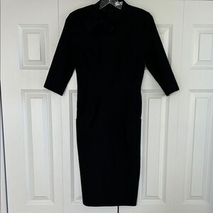 Vintage 50s pencil style dress with bow on collar. Stretchy Viscose Size M
